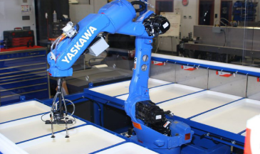 Blue robot with gripping tool