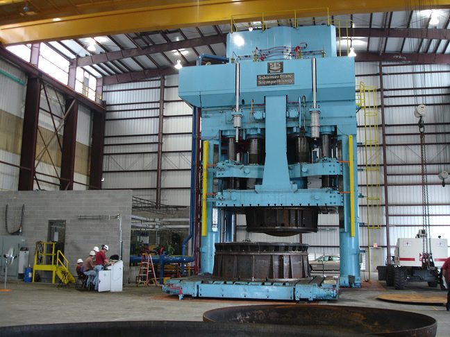Industrial press machine in factory setting
